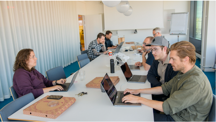 Team collaborating on a project during an AI hackathon