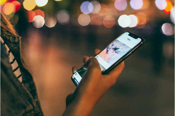 Person anonymously viewing Instagram stories on a smartphone