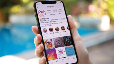 Person checking their phone, wondering can you see who views your Instagram page