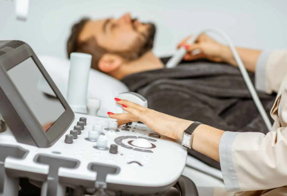 Ultrasound technician performing a diagnostic scan on a patient